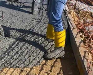 Student gaining hands-on experience finishing concrete, representing ACI Carolinas Student Membership.