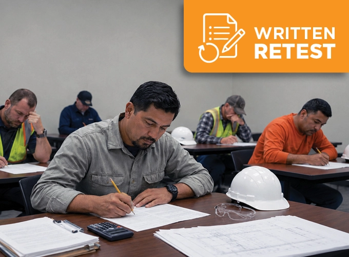 Construction professionals taking a written retest for Concrete Construction Special Inspector certification in a classroom setting.